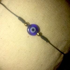 Blue eye, “evil eye” good luck charm, thread bracelet